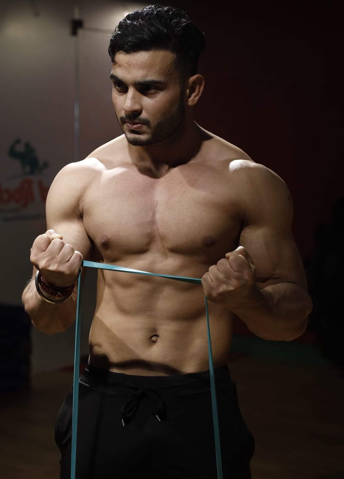 Sumit Kumar training with a resistance band